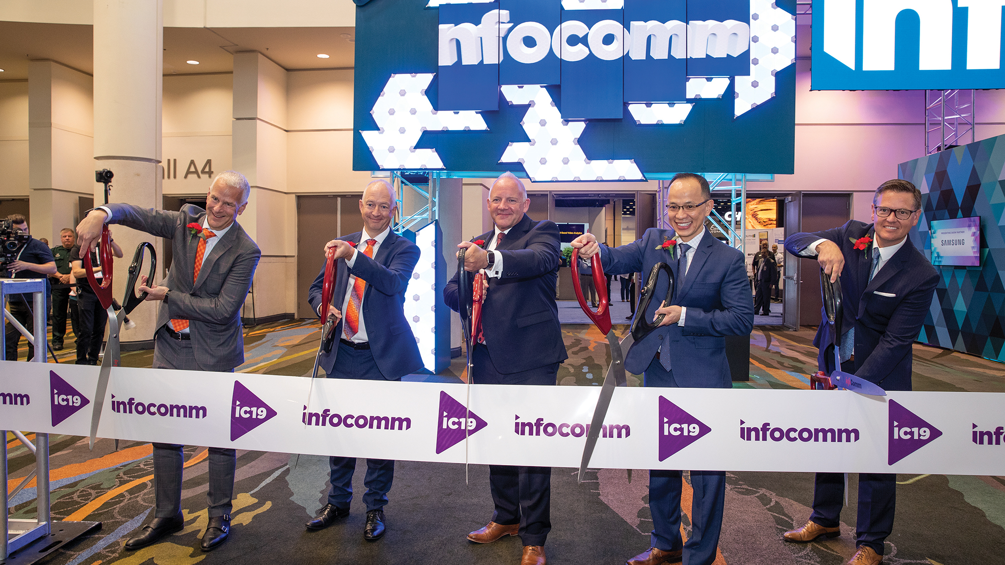 Cutting the ribbon on InfoComm 2019 were Dave Labuskes, CTS, CEO of AVIXA (left) and the AVIXA Board Officers, (l-r) Jon Sidwick, Julian Phillips, Joe Pham and Jeff Day.