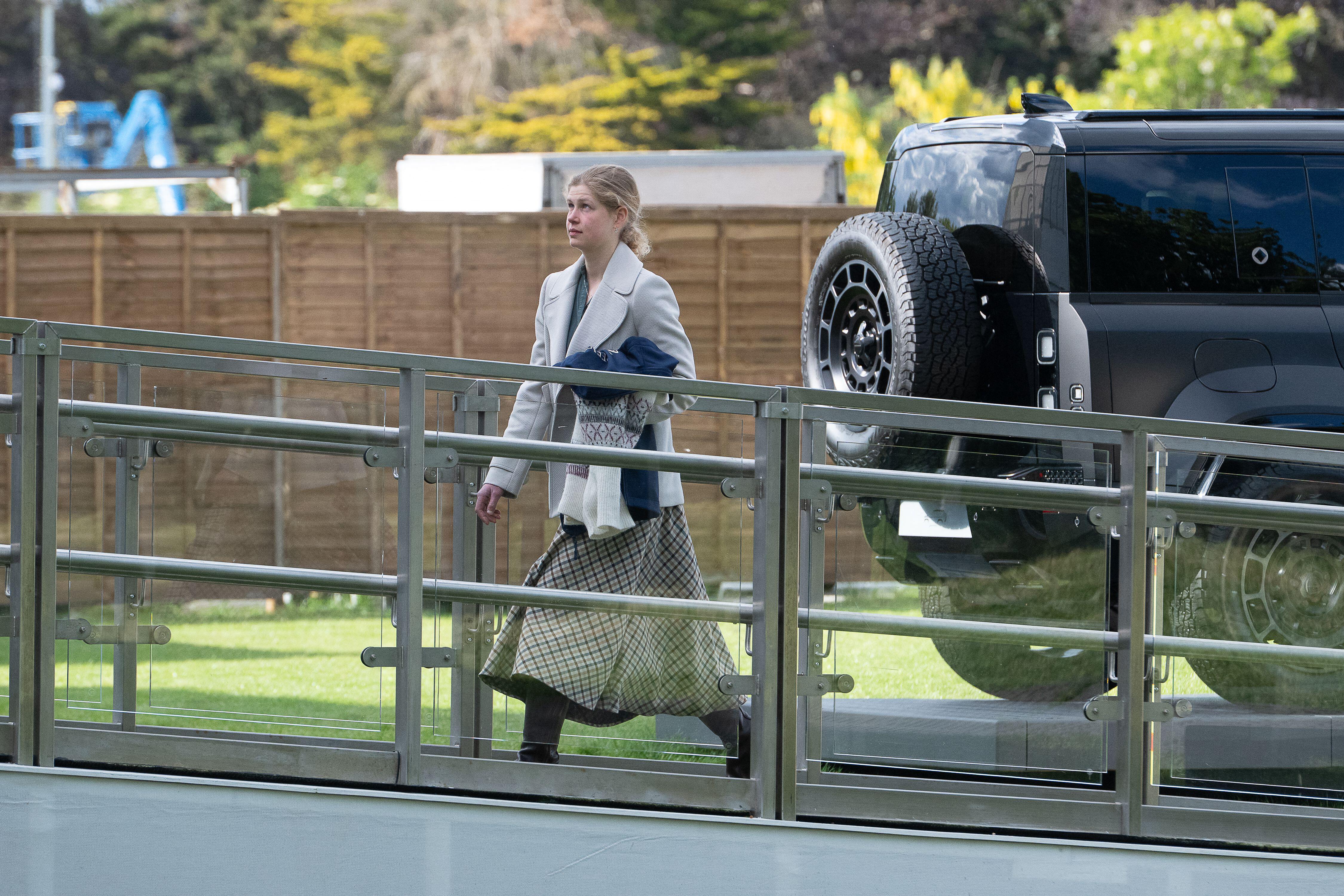 Lady Louise Windsor walking up a ramp in a skirt and blazer
