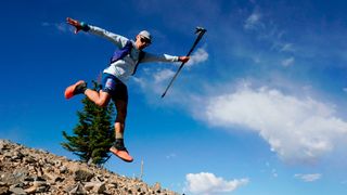 An athlete poses for a picture as he descends from the Hidden Peak aid station in the UTMB World Series: 50K Speedgoat Mountain Race on July 23, 2022 in Snowbird, Utah