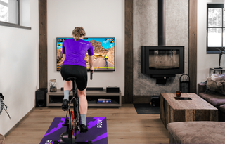 Cyclist on the turbo trainer using Rouvy