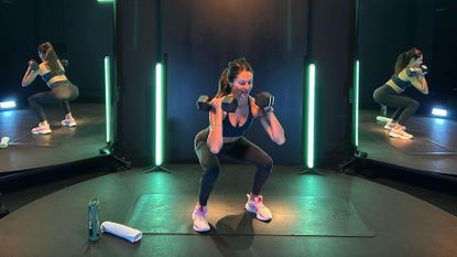 Fitness writer Lucy Gornall performing weighted squats