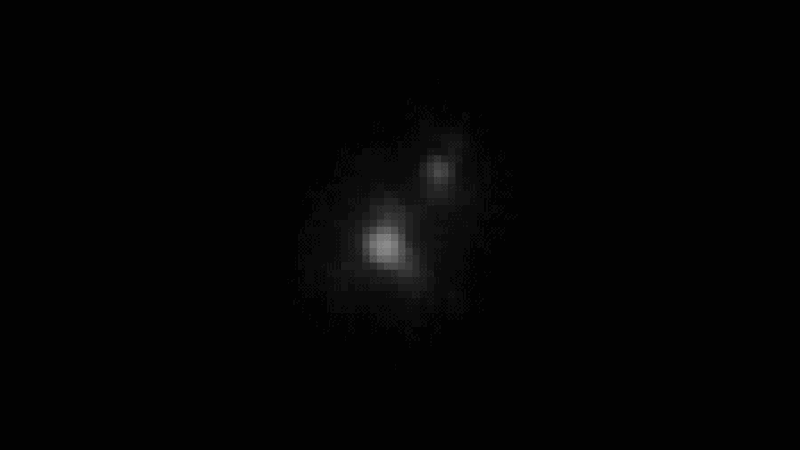 Pixels of light moving around in space, representing an earlier observation of Shenlong