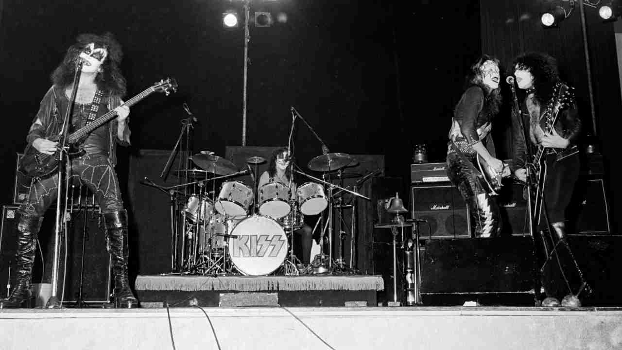 Kiss performing onstage in 1974