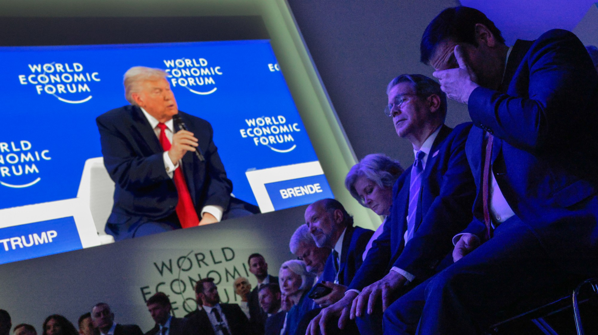 DAVOS, SWITZERLAND - JANUARY 21: Members of President Donald Trump's cabinet, including Energy Secretary Chris Wright, Commerce Secretary Howard Lutnik, Chief of Staff Susie Wiles, Treasury Secretary Scott Bessent and Secretary of State Marco Rubio, listen to Trump address the World Economic Forum (WEF) in the Davos Congress Center on January 21, 2026 in Davos, Switzerland. The annual meeting of political and business leaders comes amid rising tensions between the United States and Europe over a range of issues, including Trump's vow to acquire Greenland, a semi-autonomous Danish territory. (Photo by Chip Somodevilla/Getty Images)