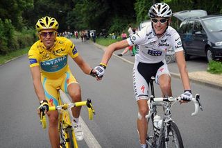 Tour champion Alberto Contador (Astana) shakes hands with runner-up Andy Schleck (Saxo Bank).