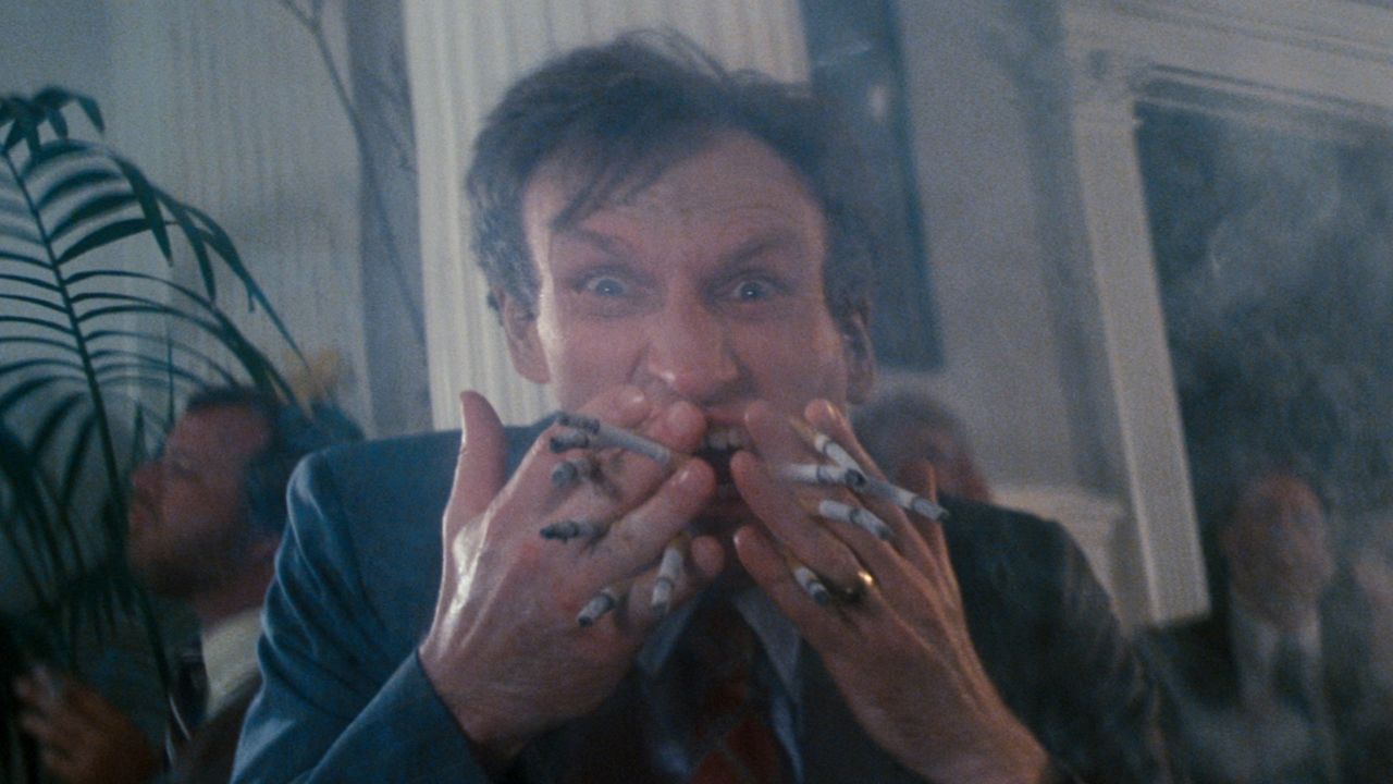 James Rebhorn smoking in Cat's Eye