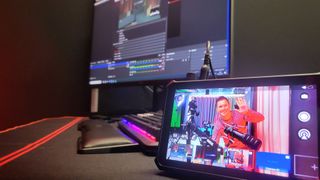 Obsbot Talent review acting as a viewing monitor next to a PC monitor running OBS