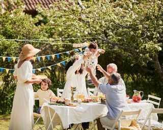 A family garden party with bunting