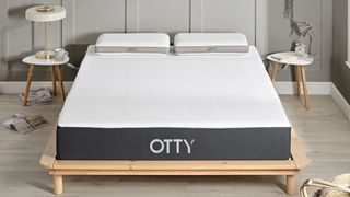 Otty Original Hybrid Mattress on a wooden bed frame