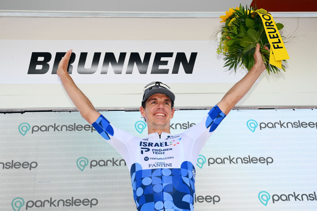 BRUNNEN SWITZERLAND JUNE 15 Daryl Impey of South Africa and Team Israel Premier Tech celebrates winning the stage on the podium ceremony after the 85th Tour de Suisse 2022 Stage 4 a 1908km stage from Grenchen to Brunnen ourdesuisse2022 WorldTour on June 15 2022 in Brunnen Switzerland Photo by Tim de WaeleGetty Images