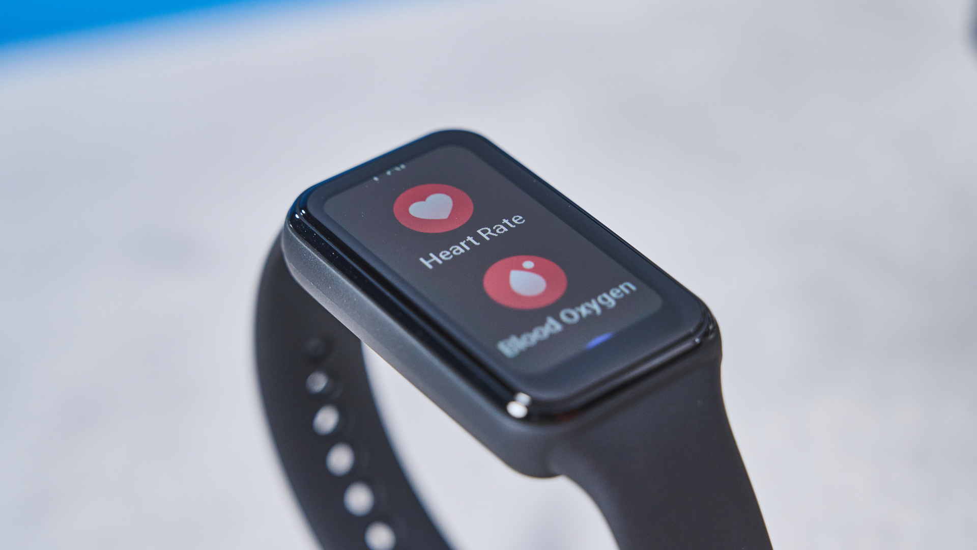 the amazfit band 7 fitness tracker, a budget fitness tracker with a simple black band and small yet bright LED screen