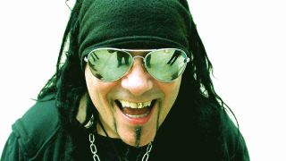 Ministry’s Al Jourgensen posing for a photograph in mirrored sunglasses