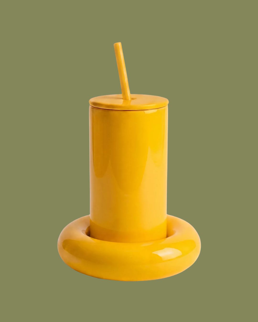 Chunky Ceramic Tumbler in Yellow against pale green background.