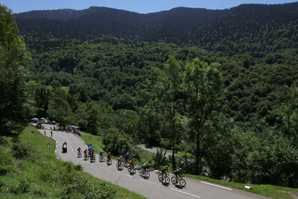 The lead breakaway cycles in the ascent of the Col de Mente during the 15th stage of the 111th edition of the Tour de France cycling race, 197,7 km between Loudenvielle and Plateau de Beille, in the Pyrenees mountains, southwestern France, on July 14, 2024. (Photo by Thomas SAMSON / AFP)