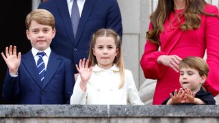 Prince George, Princess Charlotte and Prince Louis stand on the balcony of Buckingham Palace