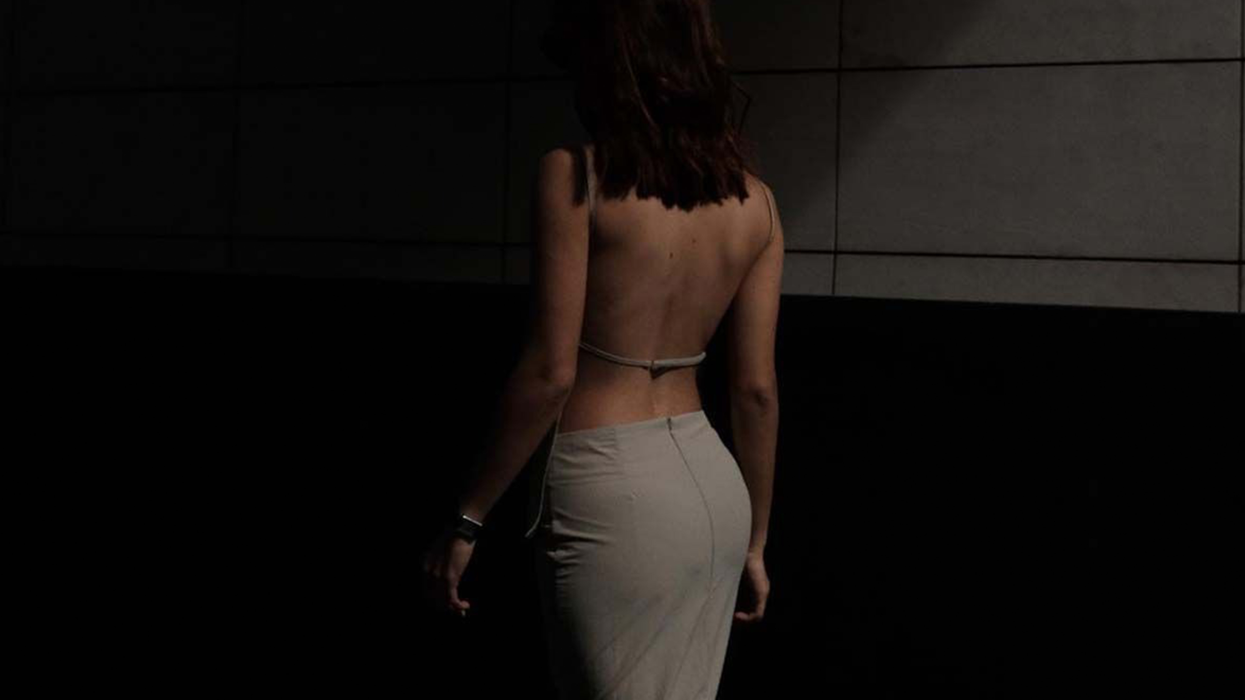 cocktail attire for women, a photo showing what to wear for cocktail attire with a woman wearing a tan dress