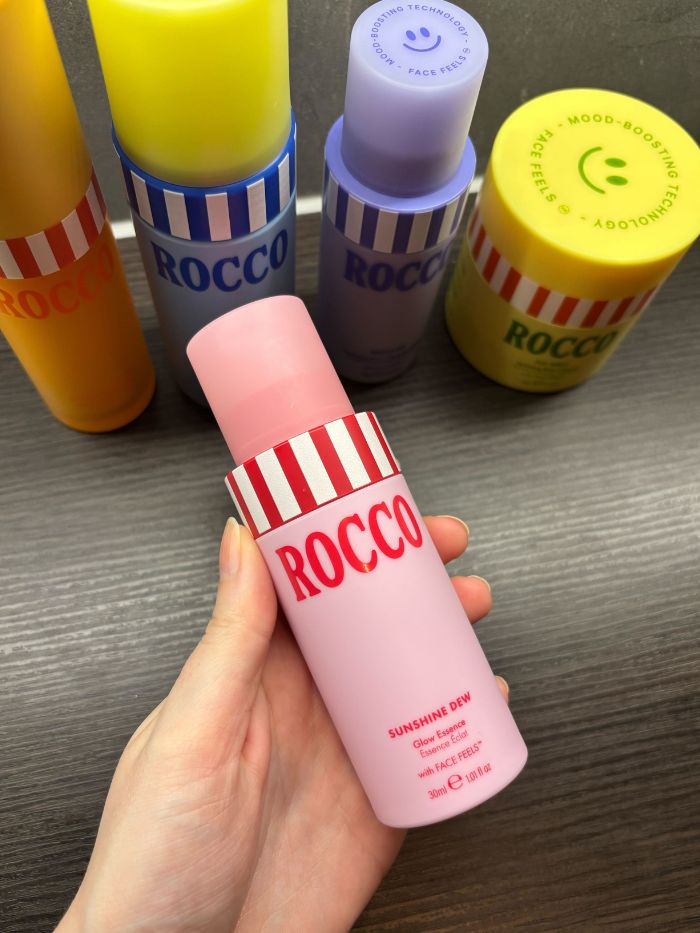 Deputy beauty editor Grace Lindsay holding the Rocco Sunshine Dew Glow Essence