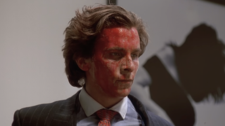 Patrick Bateman with blood-covered face in American Psycho