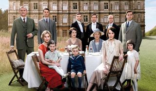Downton Abbey cast seated on lawn PBS