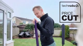 Man doing bicep curl resistance bands