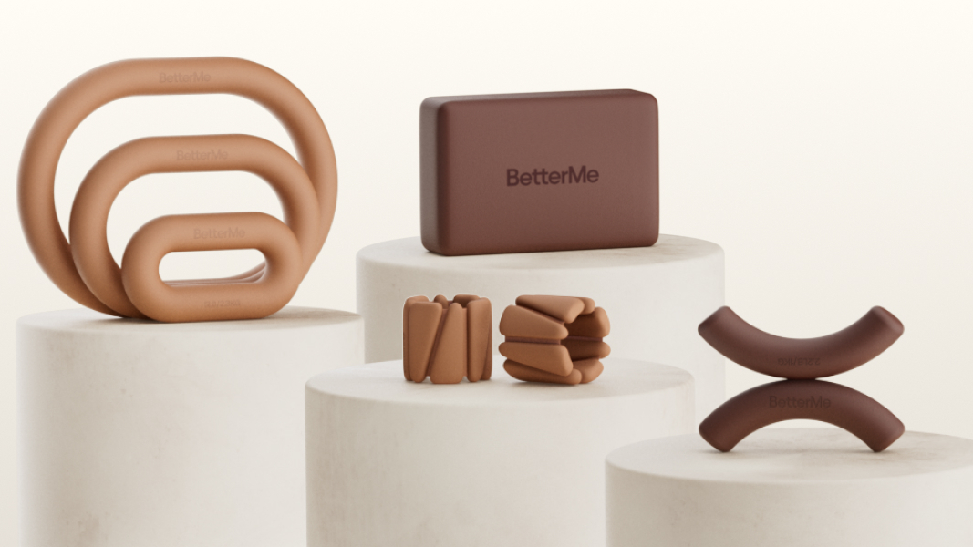 Selection of Pilates equipment on pedestals against cream background