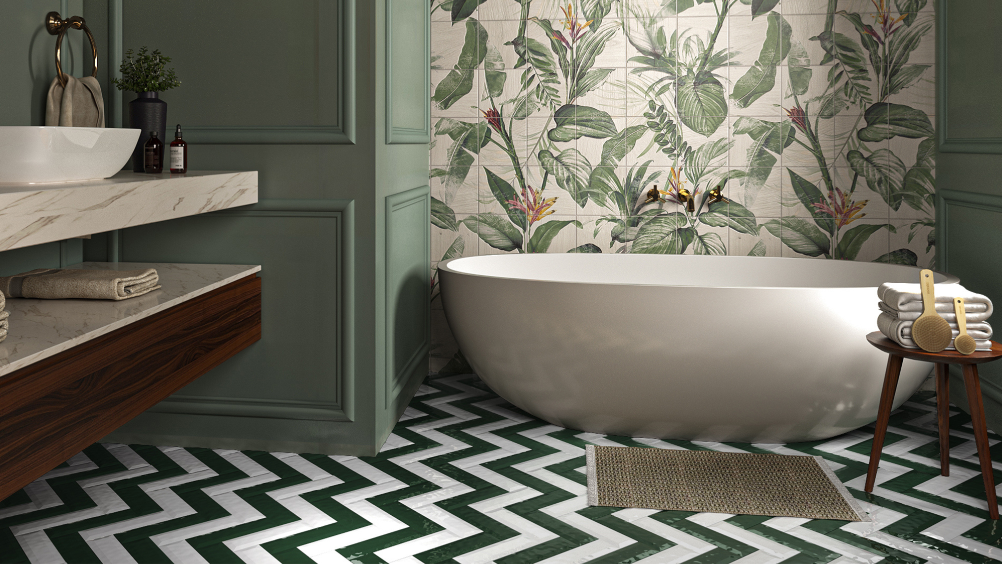 Bathroom with zigzag floor tiles, green panelled walls and a botanical wallpaper feature wall behind a freestanding bath