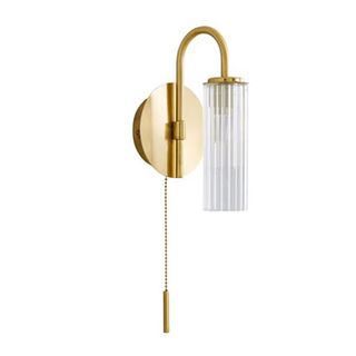 Dunelm gold wall light on white background