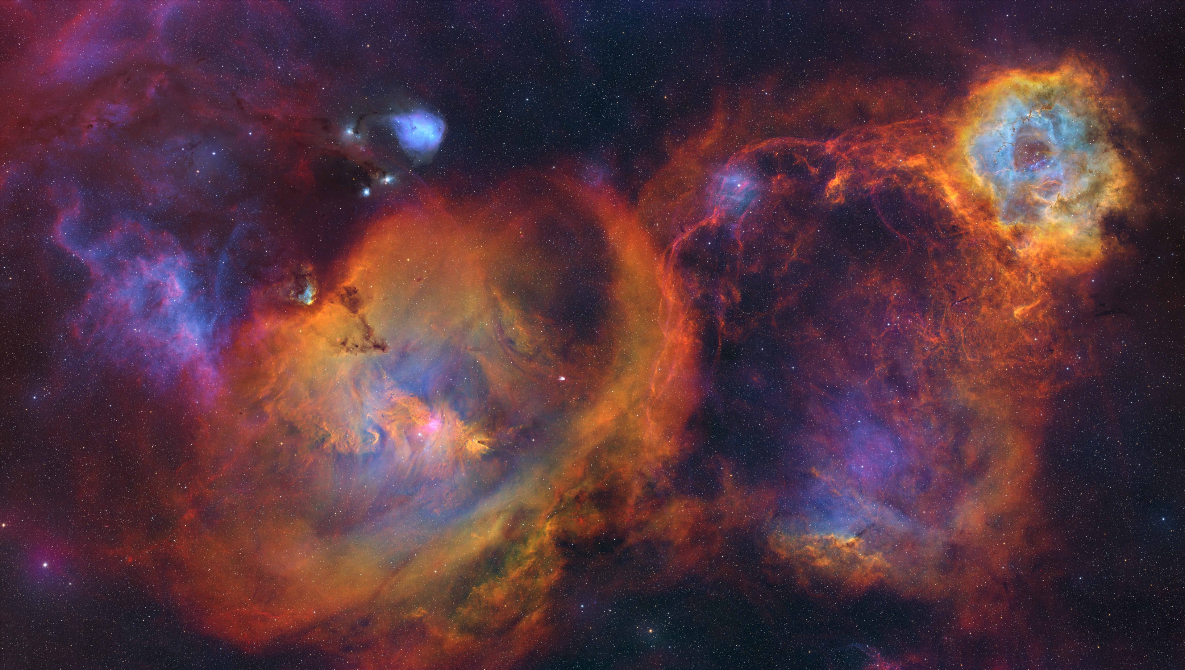 a rainbow-colored cloud of gas on a black background