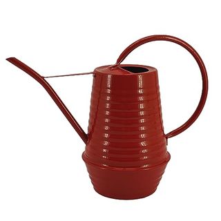 A red metal long spout watering can with ribbed edge design and a long curving handle