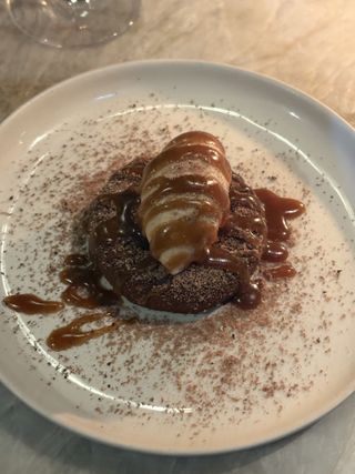 Raw cacao gateaux, sour cherry, coconut blossom ice cream, African pepper, toasted macadamia and raw caramel sauce