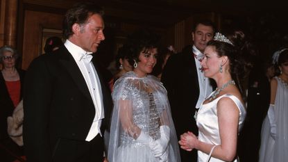 Princess Margaret greets the film star couple Elizabeth Taylor and Richard Burton at the Royal Film Performance of their new film Taming Of The Shrew, watched by actor Sir Ralph Richardson. 