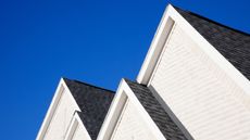 Four gabled rooflines in Texas, USA, with azure blue sky background.