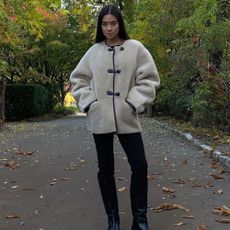 @ sasha.mei wearing a Mango coat