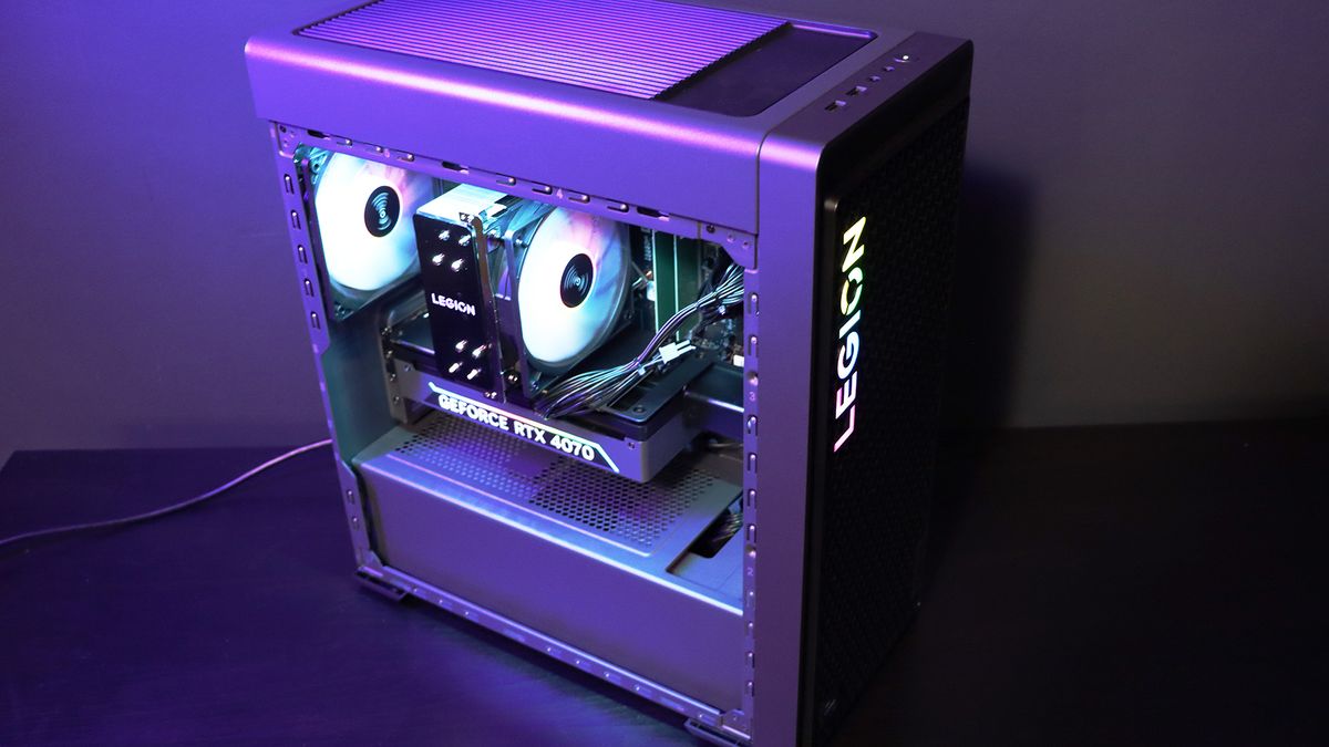 Lenovo Legion Tower 5i PC on a table with a purple light on it