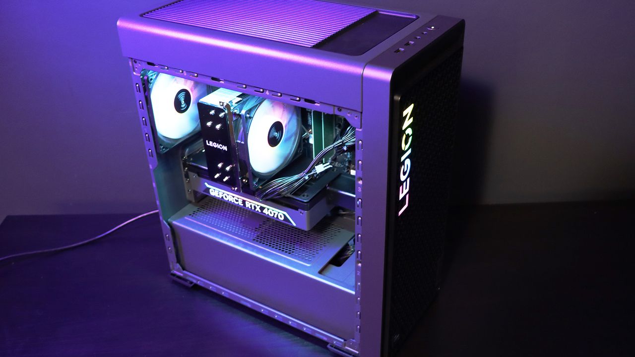 Lenovo Legion Tower 5i PC on a table with a purple light on it
