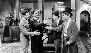 All four Marx Brothers trying to shake hands with each other