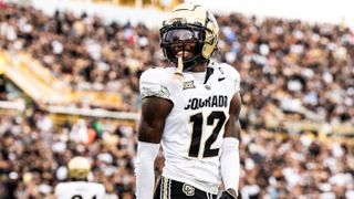 Travis Hunter (12) of the Colorado Buffaloes smiles after a play against the UCF Knights at FBC Mortgage Stadium on September 28, 2024 in Orlando, Florida.