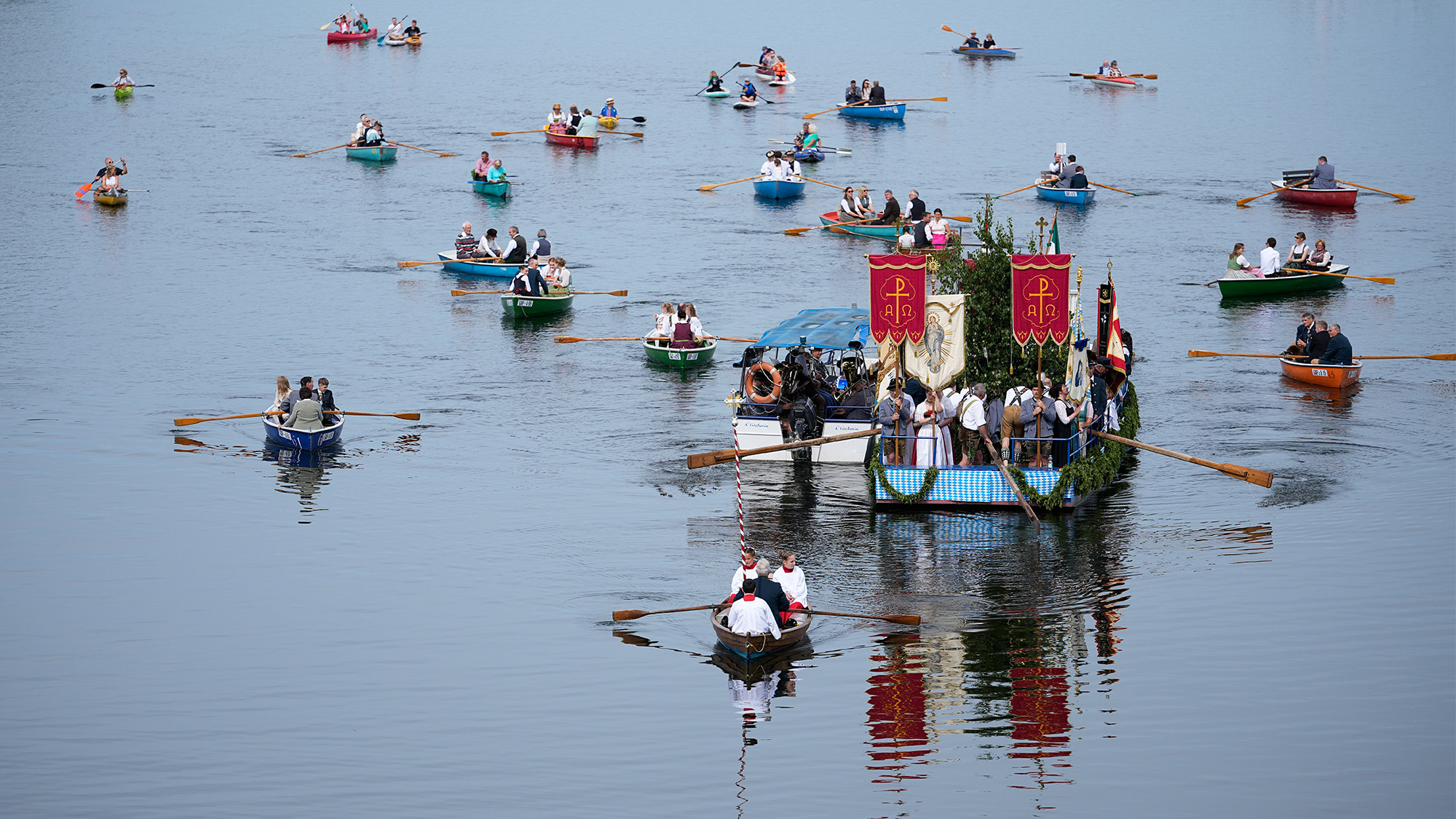 People in their boats attend the Corpus Christi procession at lake Staffelsee in Seehausen near Murnau, Germany