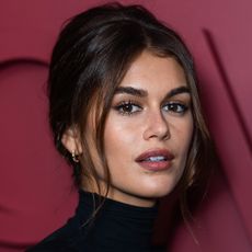 Kaia Gerber with French twist hairstyle