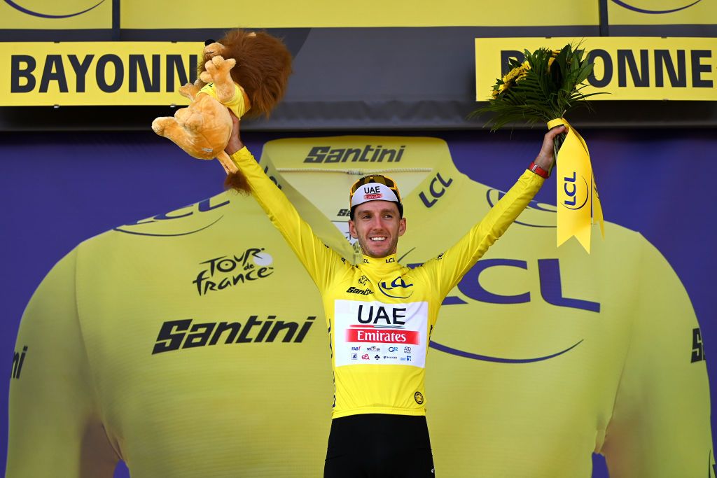 BAYONNE FRANCE JULY 03 Adam Yates of United Kingdom and UAE Team Emirates celebrates at podium as Yellow leader jersey winner during the stage three of the 110th Tour de France 2023 a 1935km stage from AmorebietaEtxano to Bayonne UCIWT on July 03 2023 in Bayonne France Photo by Tim de WaeleGetty Images