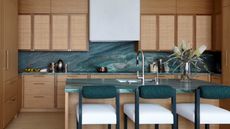 A teal colored kitchen countertop