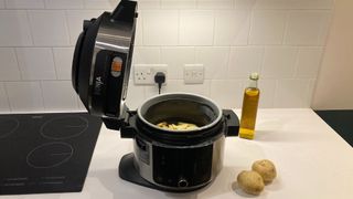 Ninja 11-in-1 Smartlid Multicooker on a kitchen countertops being reviewed