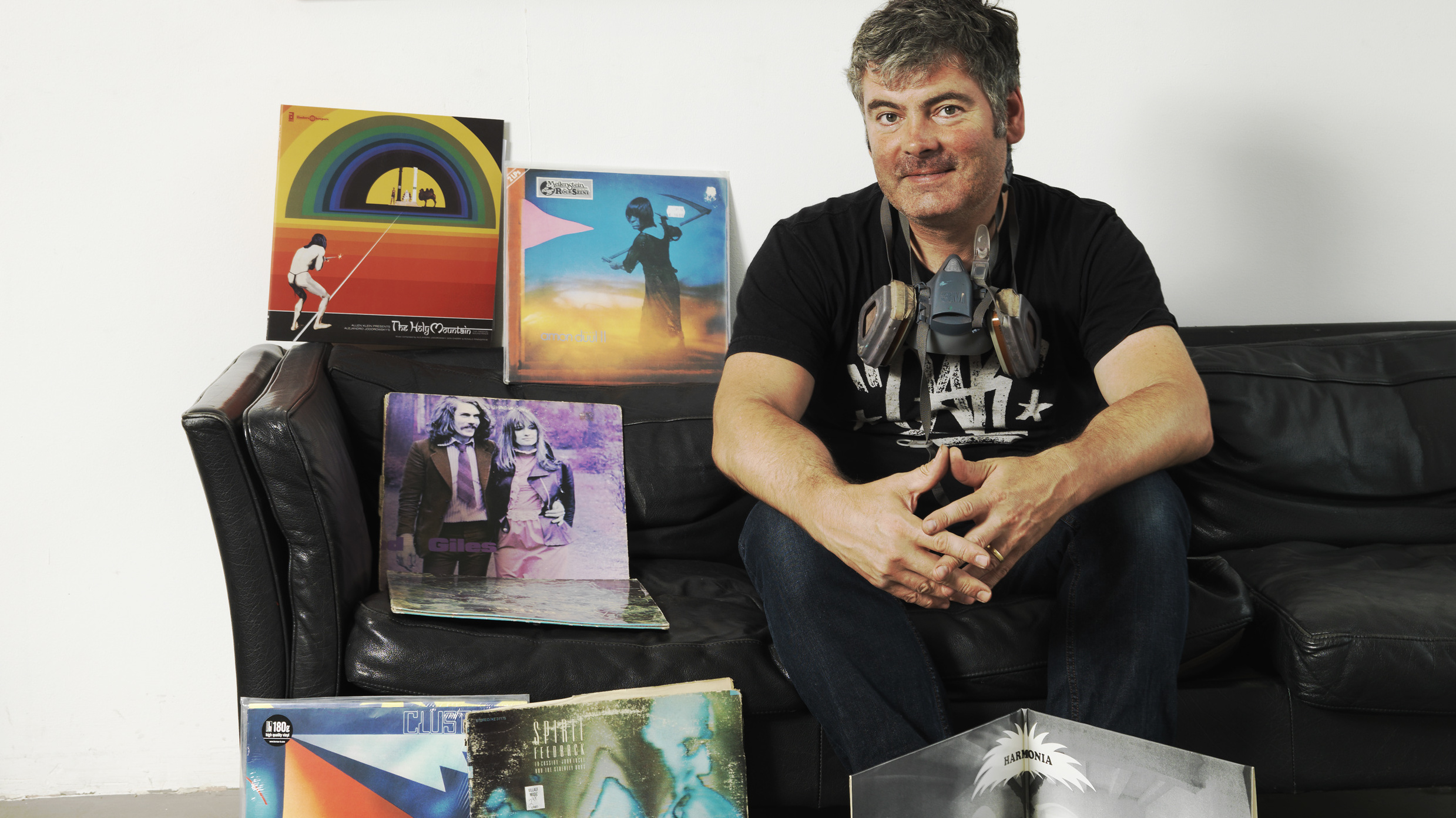 street artist and Pure Evil gallery own Charles Uzzell-Edwards with his record collection