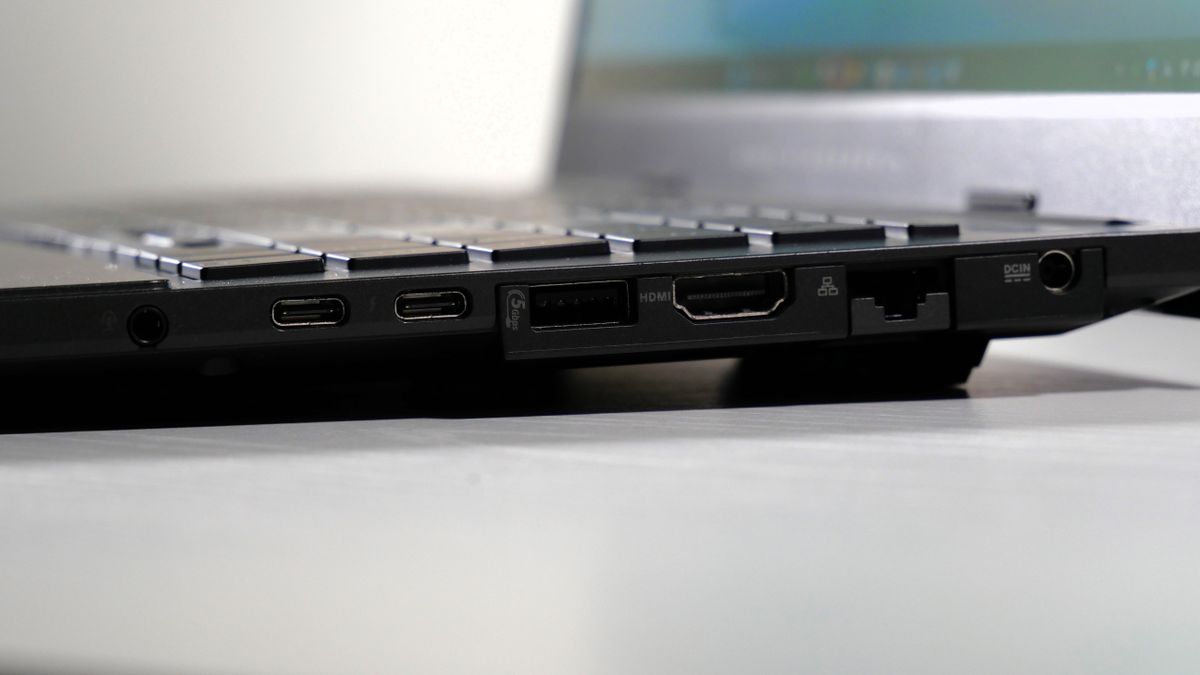 Asus Vivobook Pro 15 (N6506, 2025) on a white table, highlighting the ports on the right, including the power jack, Ethernet, HDMI, USB Type-A, two USB Type-C, and headphone jack.
