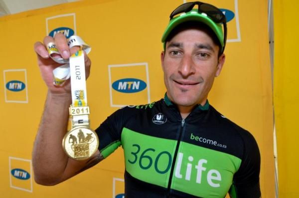 Kevin Evans with his limited edition gold medal
