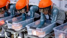 Three Netcompany Ineos riders sat at the start of the 113th Tour de France team time trial with their forearms in ice baths, to cool core temperatures. 