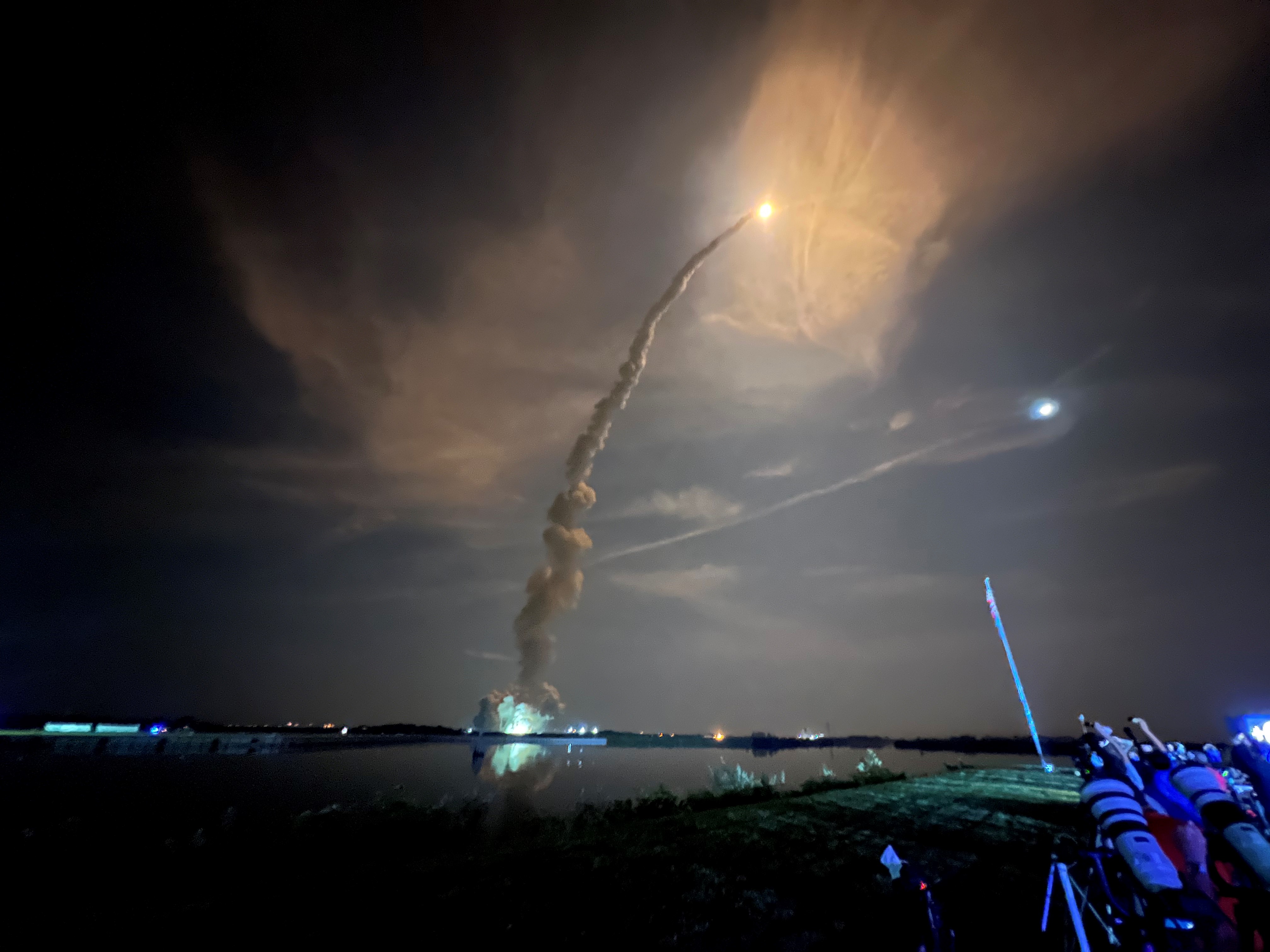 The Artemis 1 Space Launch System rocket lights up the night sky at Kennedy Space Center on Nov. 16, 2022, illuminating the smoke trail left in its wake.
