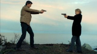 Audrey and Nathan pointing guns in Haven