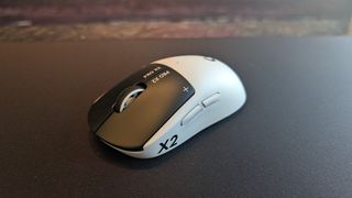 The Logitech G Pro X2 Superstrike pictured on a black mouse mat.