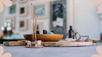 table in a home with crystals and incense to show a home that uses crystals and therefore benefits from knowing how to cleanse crystals for better energy